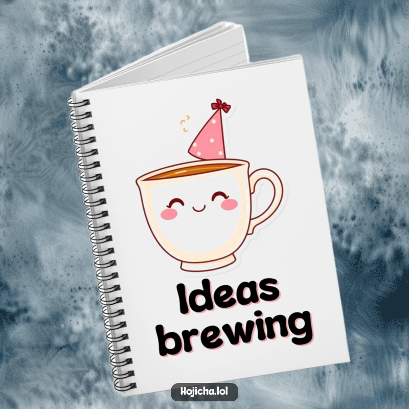 Funny teacup with a party hat and steam, on the cover of a notebook for writing.